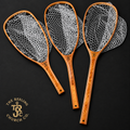 Three fly-fishing nets with copper-toned wooden handles and white mesh, arranged on a dark background. A logo for The Reeling Church Co.
